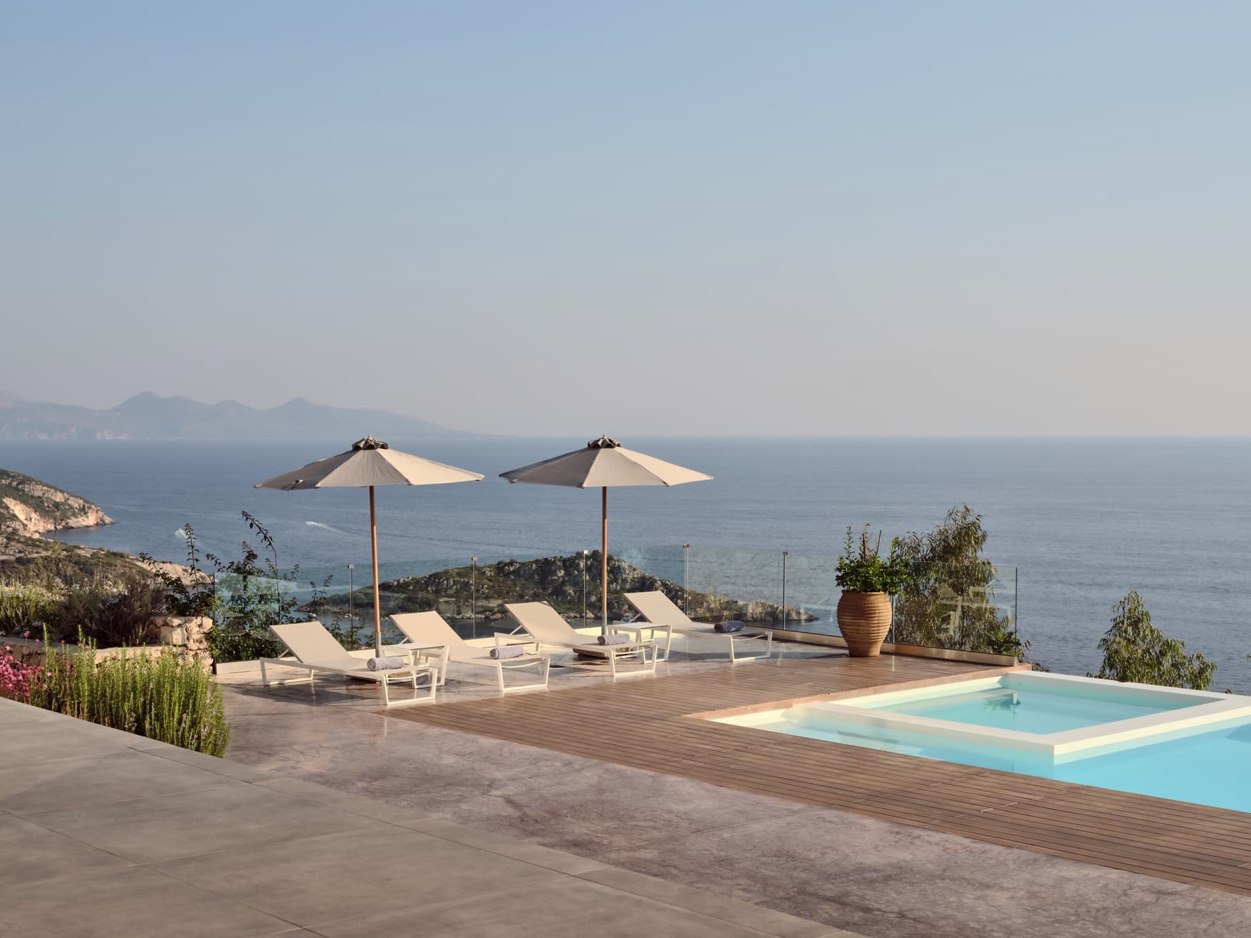 A villa pool terrace overlooking the sea